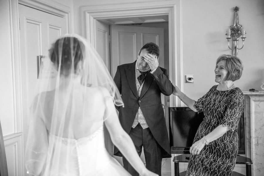 The bride's father and mother overcome with emotion. story telling documentary by john fox wedding photography