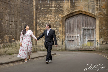 Pre-wedding Shoot in Oxford showing couple walking through the streets
