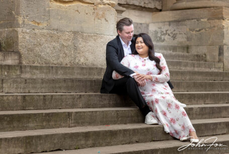 Pre-wedding Shoot in Oxford showing the couple sat on stone steps