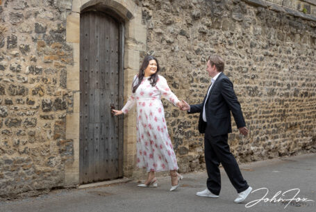 Pre-wedding Shoot in Oxford. Bride leading groom into a secret garden